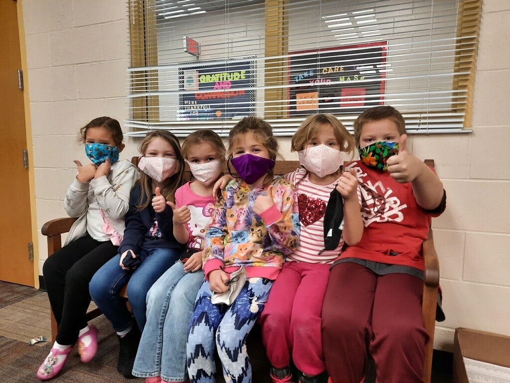 Students wearing masks donated by Lake Country Quilters.
